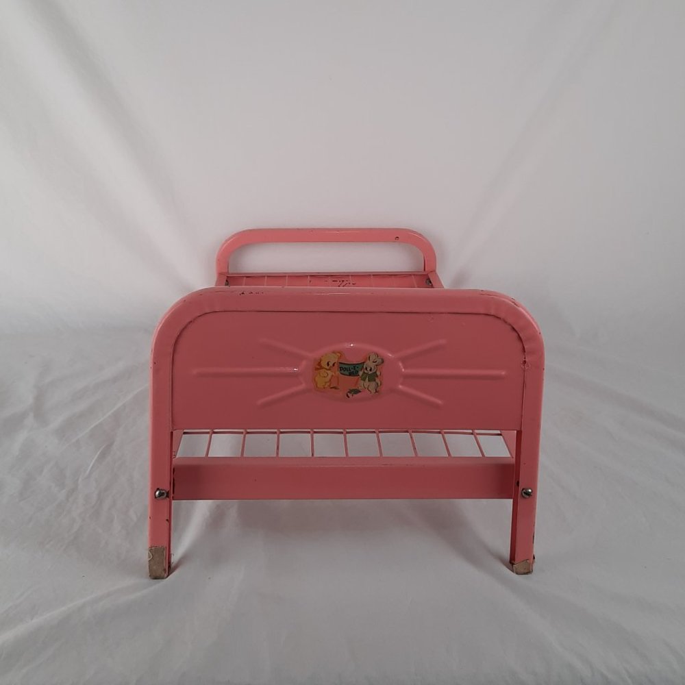 Vintage pink metal Doll-E-Bed from the 1950's